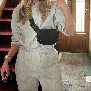 Grey cropped sweatshirt.